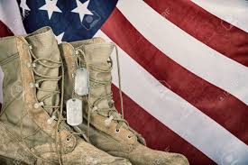 A Pair of Boots With Tags on Them